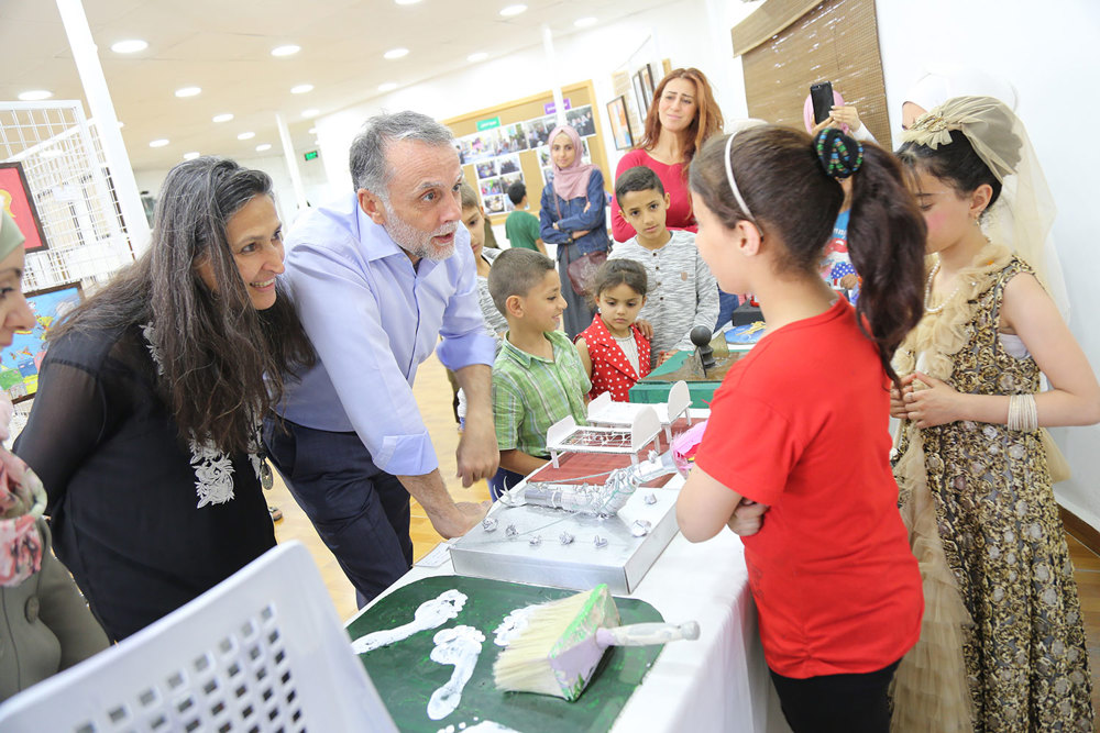 Fadi Ghandour & Samar Dudin With Children Presenting Their Art Works